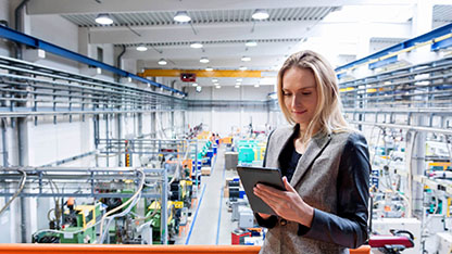 Inspector with tablet in warehouse