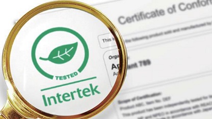 The Intertek Green Leaf Mark under a magnifier.