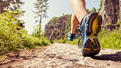 Running shoe in use on trail