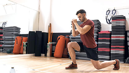 Man stretching in a gym