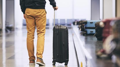 Man at luggage pickup area